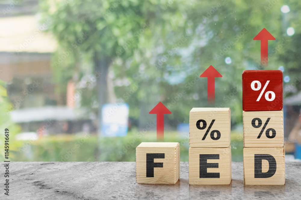 Poster stack of wooden cubes with the text of fed and percentage symbol with red arrow pointing up