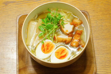 Warm and tasty ramen noodles, with egg, bamboo shoots and chicken cutlet.