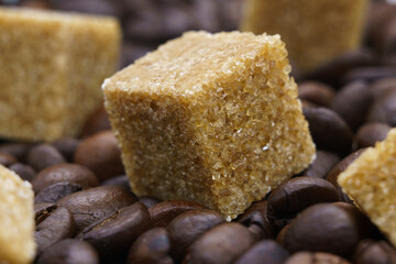 beautiful picture, a background with coffee and sugar, a cube of cane sugar on coffee beans, a close-up of a coffee and sugar