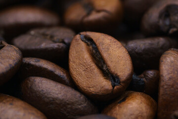 beautiful picture, background with coffee beans, close-up of spilled coffee, a mixture of robusta and Arabica