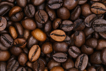beautiful picture, background with coffee beans, close-up of spilled coffee, a mixture of robusta and Arabica