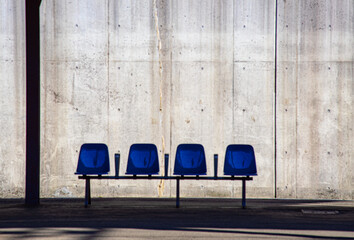 A bench on a quiet station platform