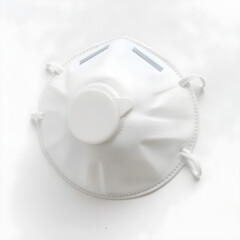 A disposable dust mask with a curved design, adjustable nose clip, and elastic straps, on a white background