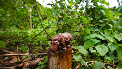 hippo toy, this cute toy is photographed on a flat piece of wood, looks unique