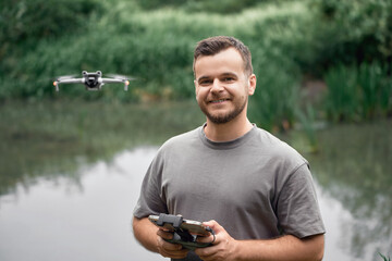 Drone pilot flying UAV in natural setting