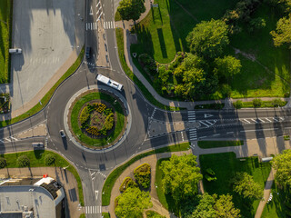 Aerial top-down photo of roundabout surrounded by green spaces and urban infrastructure in Turi...