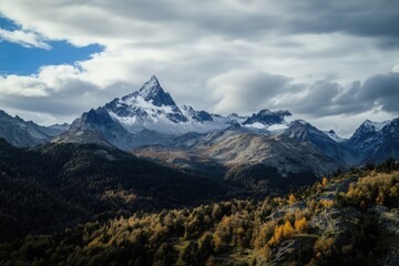 Obraz premium A scenic view of a mountain range with a few trees scattered across the landscape