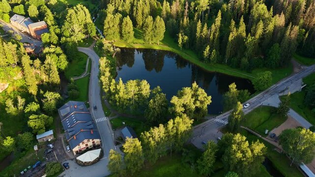 Beautiful Aerial Establishing Shot Of Ligatne Town Center Located On The River Tributary Of Gauja National Park, Latvia.