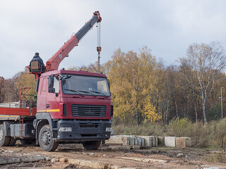 The worker works on the truck crane