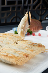 Fishnet Pot Stickers with Chive and Oil Residue Stuffing