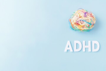 ADHD Concept with Colorful Tangled String Ball on Blue Background