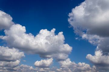 White Cumulus clouds on a beautiful Sunny day. as a background