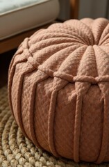 Obraz premium closeup on mocha mousse toned woven pouf on natural jute rug with soft textures and cozy vibes. interior design inspiration in color of the year 2025 tones.