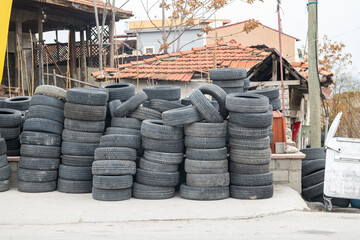 Piles of old used car tires.