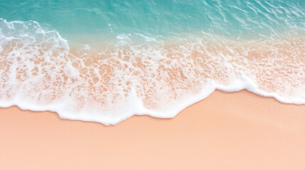 Waves gently lapping on a sandy beach with clear blue water during a sunny day