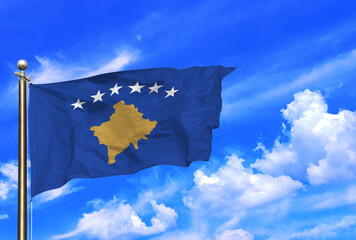 Kosovo Flag Waving Beneath a Clear Blue Sky