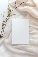 Mockup of a white greeting card on an aesthetic background with dried branch. Perfect for stationery and minimalistic design projects.