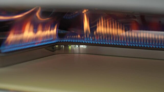 Lighting up a portable pizza oven at maximum flame then reduced to lowest flame 30fps.