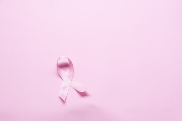 Pink ribbon on color background, top view. Cancer awareness Photo Formats