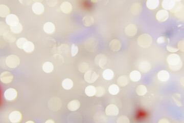 Chaotically placed bokeh circles shine with festive lights. Festive Christmas background.