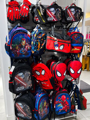 Fototapeta premium Kyiv, Ukraine - December 18, 2024: Colorful display of superhero-themed backpacks and handbags in retail store setting