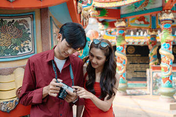 Joyful Travelers Exploring Vibrant Chinese New Year Celebrations with Colorful Lanterns and Festive Decorations