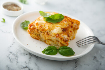 Homemade meatless lasagna with basil
