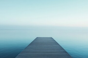 Fototapeta premium A tranquil wooden pier stretches out over a calm, blue expanse, merging seamlessly with the sky, suggesting infinite possibilities and peaceful solitude for contemplation.