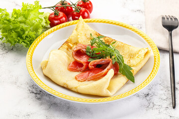 Russian pancake with salmon fish
