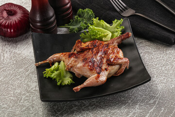 Grilled quail in the plate