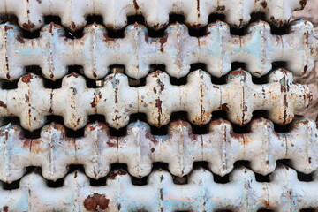 A CloseUp of Textured Metal Radiators Featuring Various Rust and Patina Details