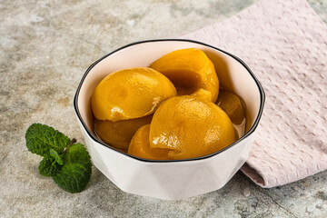 Canned marinated peach in syrop