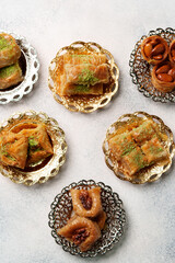 Assorted sweet desserts displayed on decorative plates in a cozy setting during festive celebration