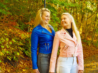 Fototapeta premium Two women walking in autumn park