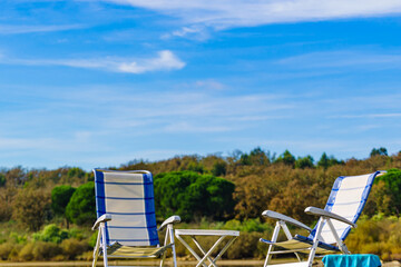 Two empty camp chairs on nature