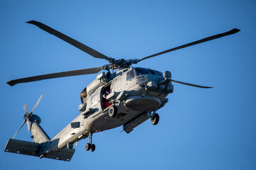 A U.S. Navy Helicopter Flying Overhead