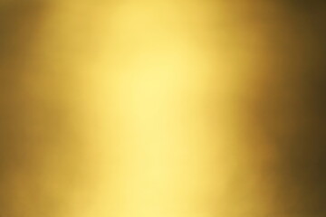 夕日を映して輝く海をぼかした金色の背景