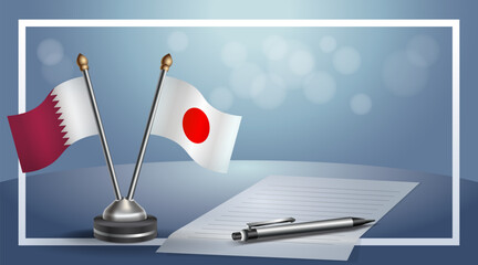 Qatar and Japan National flags on small table with bokeh background, cooperative relationship