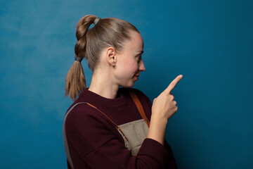 Obraz premium standing and pointing to object on copy space, rear view