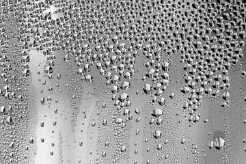 background, unusual, abstract. drops of morning dew, condensation on the glass. wet glass. water drops close-up. beautiful background for text. Spray cool condensate water on the glass