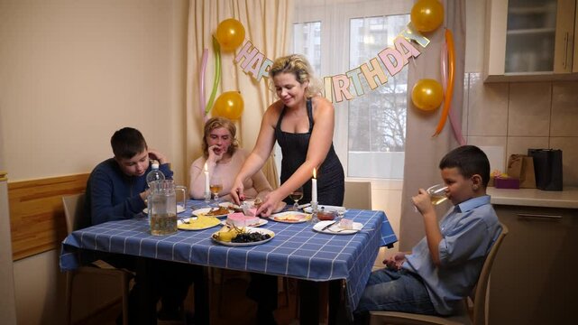 A cake with a candle for 41 years is served to the table. Birthday celebration.