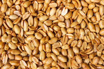 Pile of roasted salted peanut, group of nuts. Top view