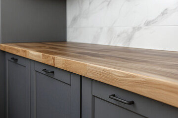 Modern kitchen with wooden countertop and gray cabinets