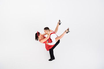 Photo of cheerful active couple professional dancers choreographers dancing rock roll isolated on...