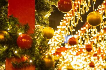Christmas decoration arrangements with colorful balls and lights. Bokeh