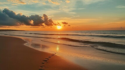 Obraz premium Sunset view of an empty sandy beach 