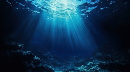 Obraz premium Sunlight beams penetrate clear water revealing underwater terrain and aquatic life in a vibrant marine environment