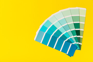 Color palette on a bright colored background. Color palette guide. paper catalog of rainbow color....
