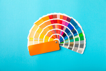 Color palette on a bright colored background. Color palette guide. paper catalog of rainbow color....