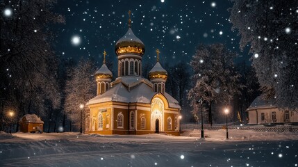 Fototapeta premium Snow-covered tree with ornaments and church illuminated by festive lights in winter twilight